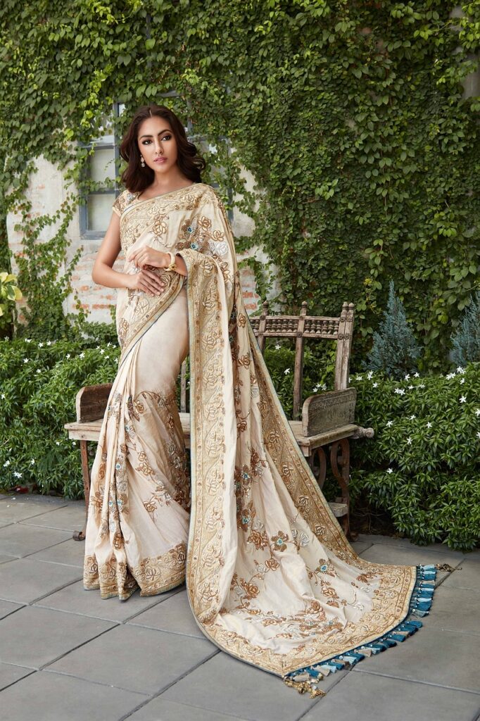 lady standing wearing saree